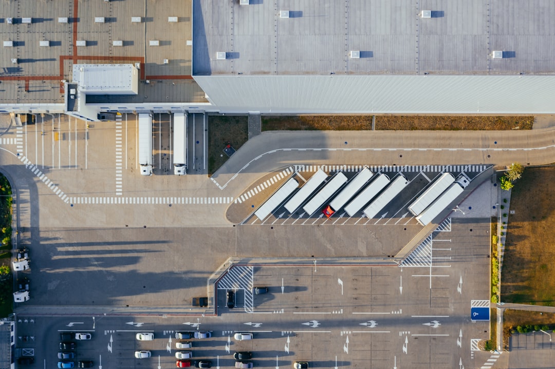 aerial-view-of-vehicles-in-parking-area-oh0ditwohi4